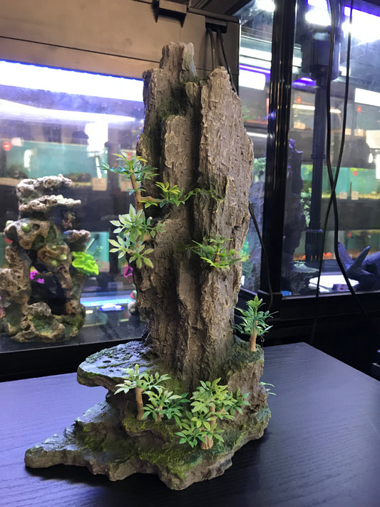 Tall rock with plants image 1