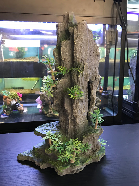 Tall rock with plants image 0